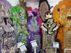 The Backstreet Cultural Museum in New Orleans displays past Mardi Gras Indian suits of Big Chiefs, Queens, and more.
