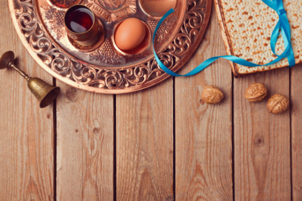 Passover background with matzo, wine and old seder plate. View from above